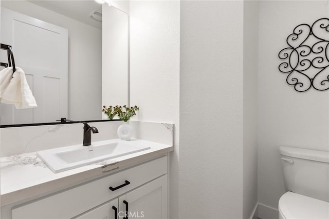 9 Harkness Ct, Chico, CA 95973 - half bathroom featuring vanity and toilet