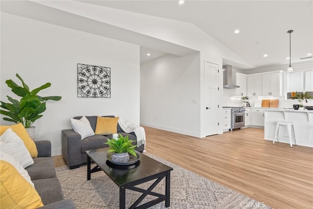 9 Harkness Ct, Chico, CA 95973 - living area with vaulted ceiling, light wood-style floors, baseboards, and recessed lighting