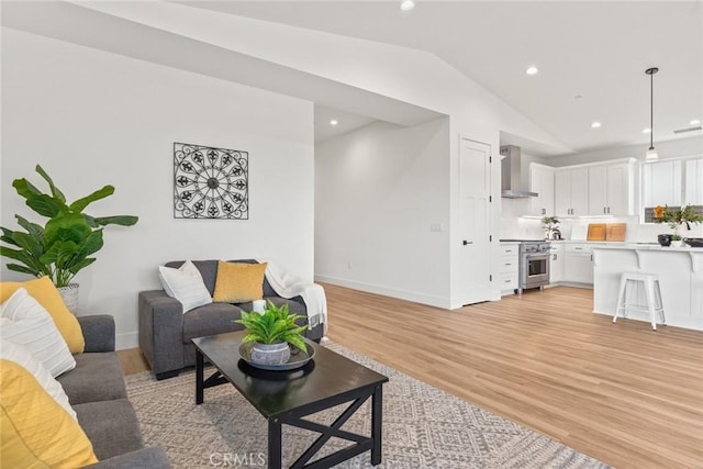 9 Harkness Ct, Chico, CA 95973 - living room featuring vaulted ceiling, light wood-style floors, and recessed lighting