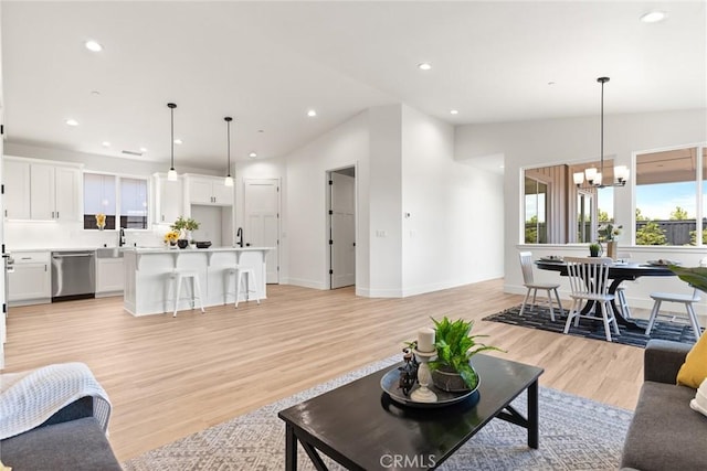 9 Harkness Ct, Chico, CA 95973 - living area featuring a chandelier, light wood-style floors, and recessed lighting