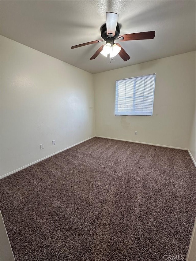 spare room with carpet flooring, a textured ceiling, and ceiling fan