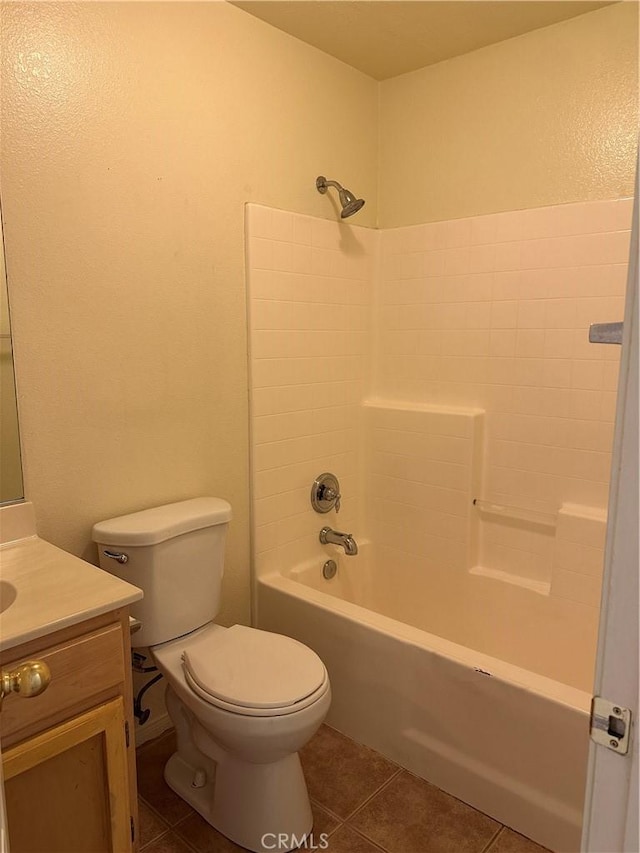 full bathroom with tile patterned flooring, vanity,  shower combination, and toilet