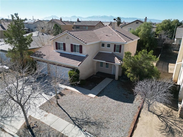 birds eye view of property with a mountain view