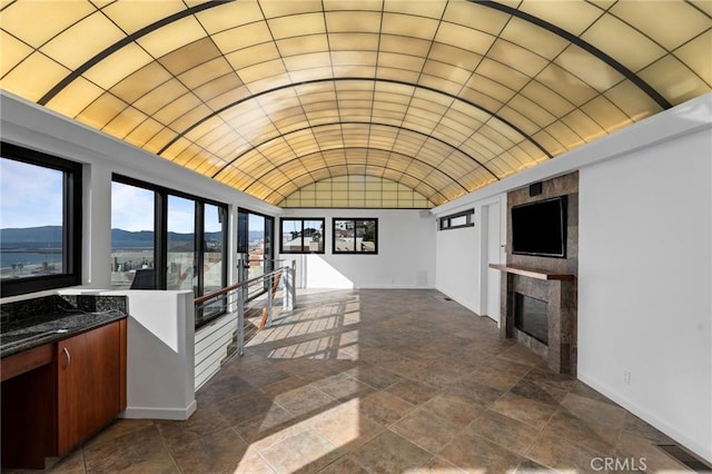 interior space featuring a mountain view and vaulted ceiling