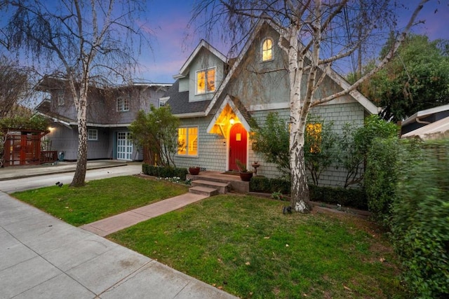 view of front of property with a yard