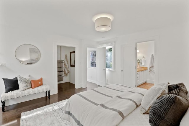 bedroom with dark hardwood / wood-style flooring