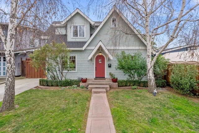 view of front of house with a garage and a front lawn