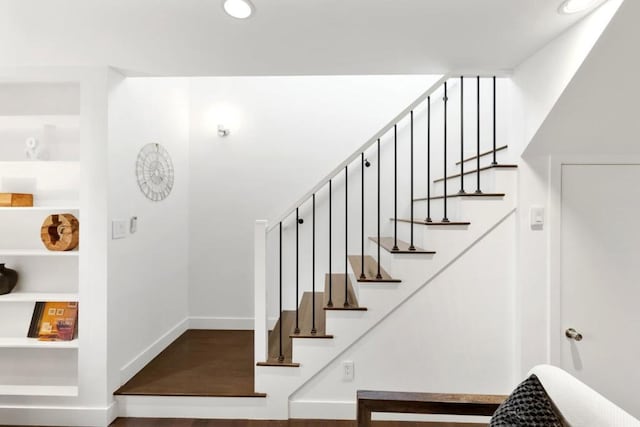 staircase with built in shelves