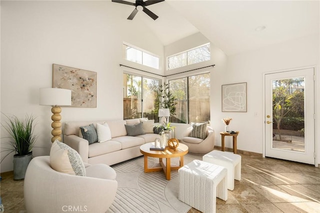 living room featuring high vaulted ceiling and ceiling fan