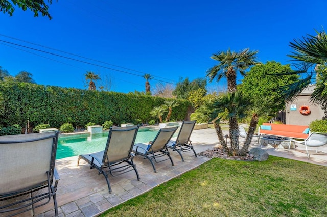 view of patio / terrace with a fenced in pool and pool water feature