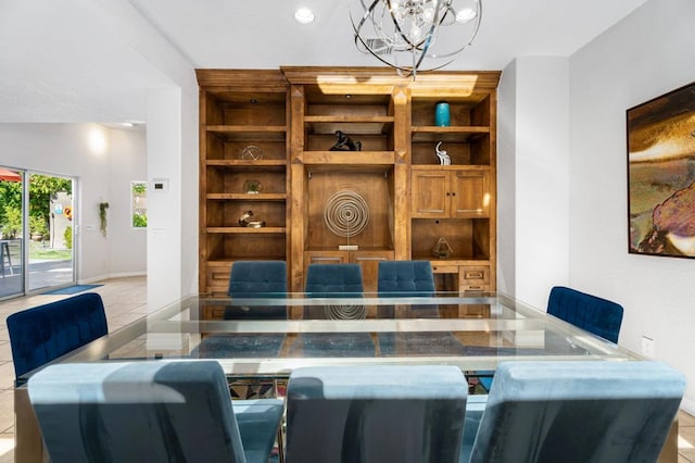 dining room with light tile patterned floors, built in features, and a chandelier