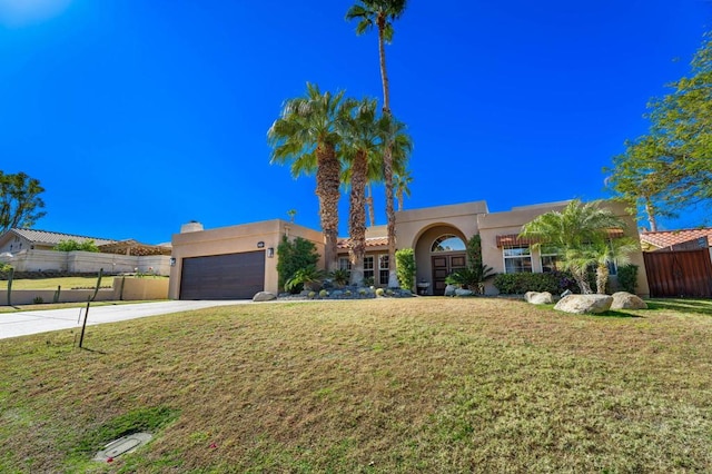 view of front facade featuring a garage and a front yard