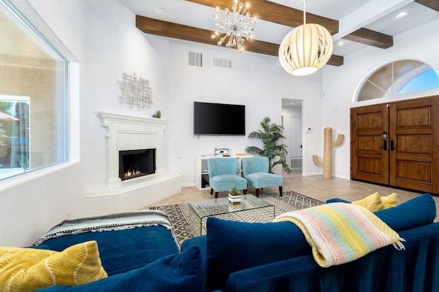 tiled living room with beamed ceiling, a premium fireplace, and a chandelier