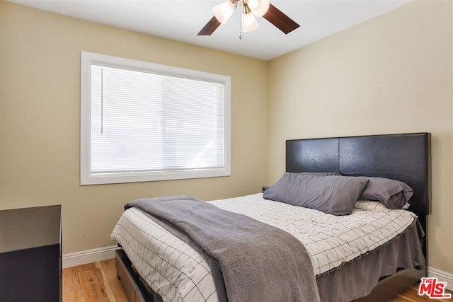 bedroom featuring hardwood / wood-style flooring and ceiling fan