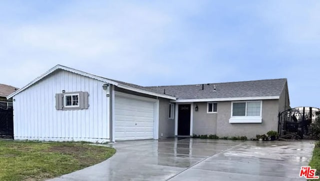 view of front of property with a garage and a front yard