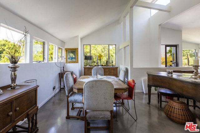 dining room with vaulted ceiling