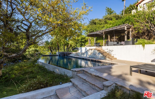 view of swimming pool featuring a patio