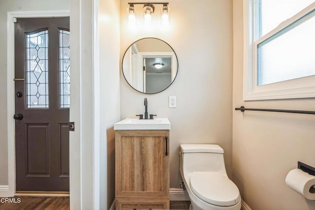 bathroom with vanity and toilet