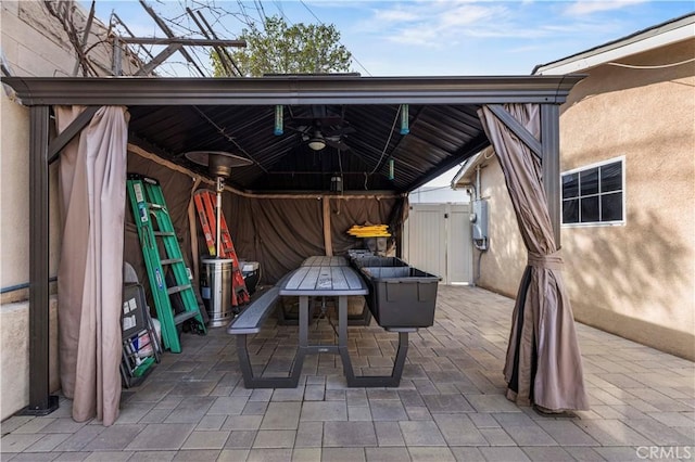 view of patio / terrace featuring a gazebo and ceiling fan