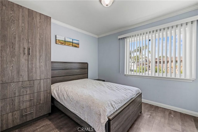 bedroom featuring ornamental molding and dark hardwood / wood-style floors