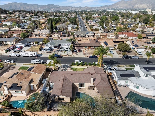 birds eye view of property with a mountain view