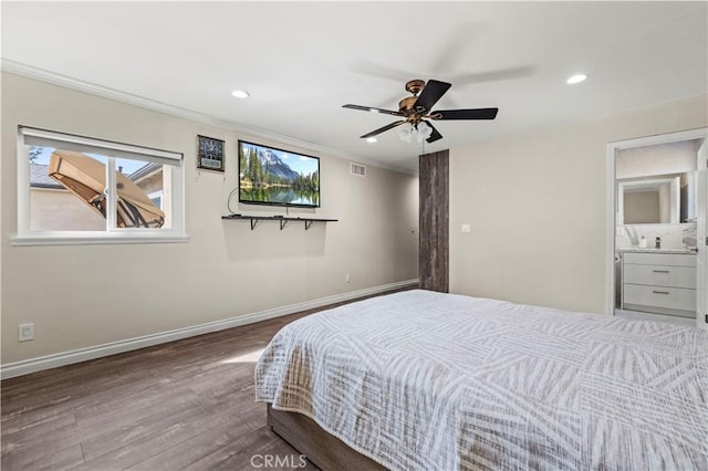 bedroom featuring sink, ceiling fan, hardwood / wood-style floors, ensuite bathroom, and ornamental molding