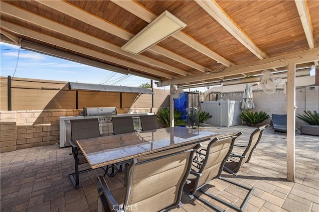 view of patio / terrace featuring area for grilling and an outdoor bar