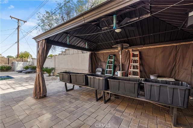 view of patio featuring a gazebo and ceiling fan