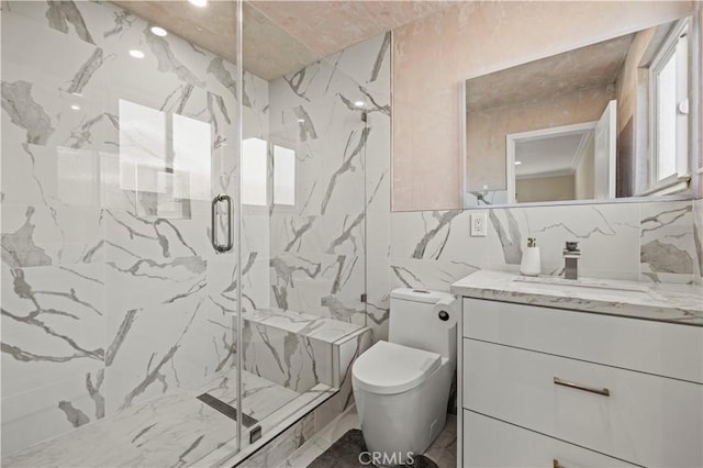 bathroom with tile walls, vanity, decorative backsplash, a shower with shower door, and toilet