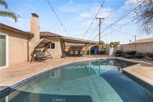 view of swimming pool featuring a patio