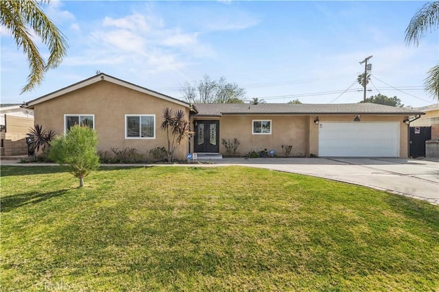 ranch-style home featuring a garage and a front yard