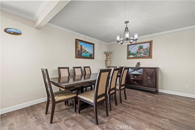 dining room with an inviting chandelier, ornamental molding, and dark hardwood / wood-style floors