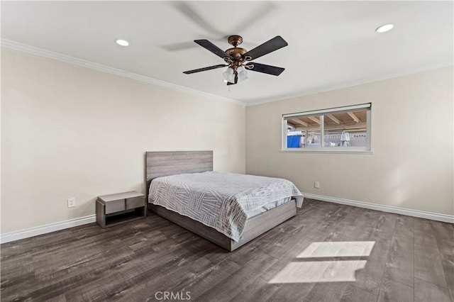 unfurnished bedroom with crown molding, ceiling fan, and dark hardwood / wood-style floors