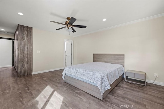 bedroom with dark hardwood / wood-style flooring, ornamental molding, and ceiling fan