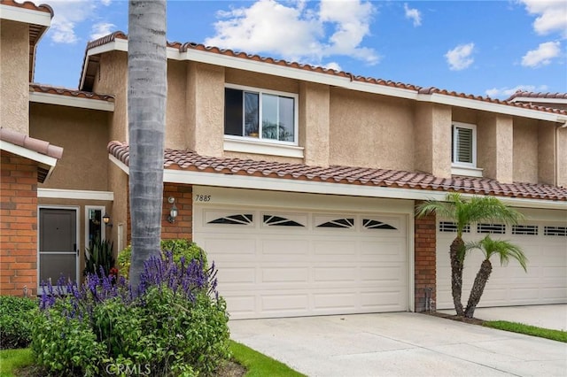 mediterranean / spanish-style home featuring a garage