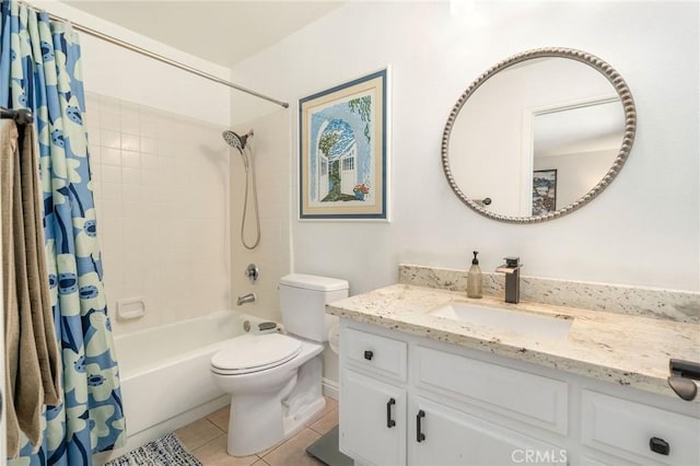 full bathroom featuring vanity, tile patterned floors, toilet, and shower / bath combo with shower curtain