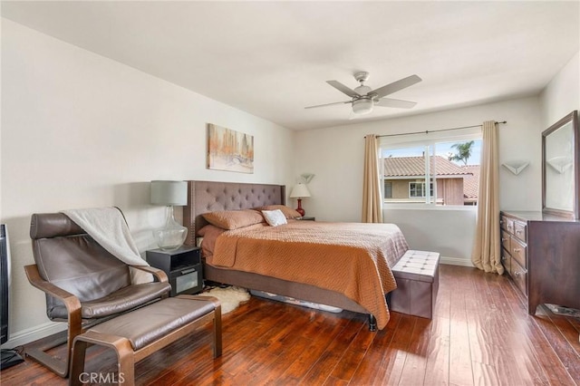 bedroom featuring dark hardwood / wood-style flooring and ceiling fan