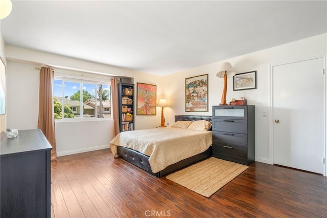 bedroom featuring dark wood-type flooring