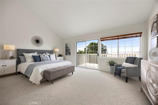 carpeted bedroom with access to outside and high vaulted ceiling