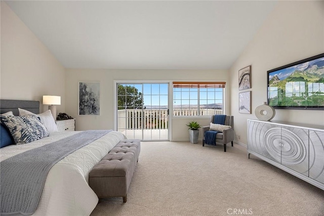 bedroom featuring carpet flooring, vaulted ceiling, and access to outside