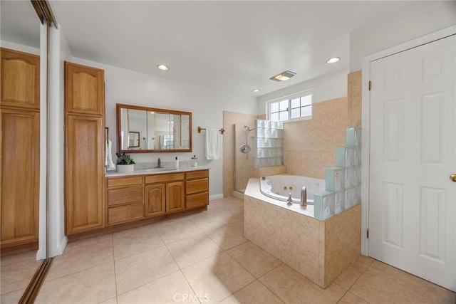 bathroom with tile patterned floors, independent shower and bath, and vanity