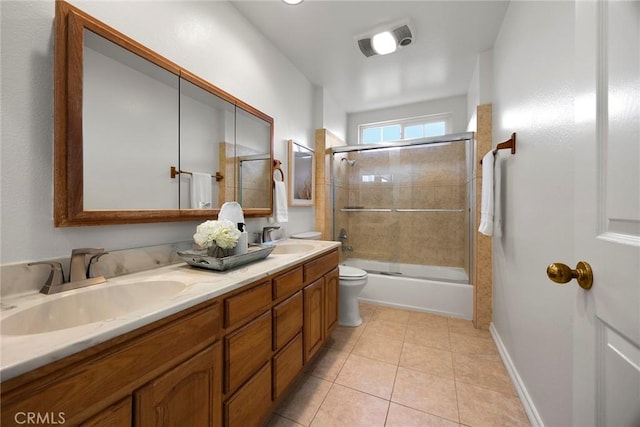 full bathroom with enclosed tub / shower combo, toilet, tile patterned floors, and vanity