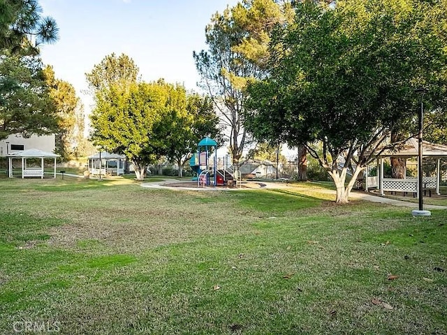 view of yard with a gazebo and a playground