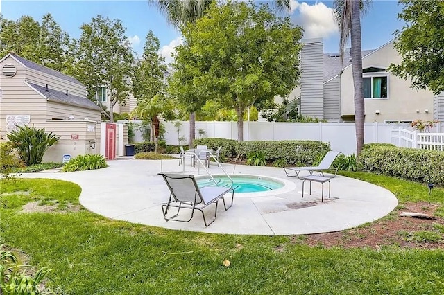 view of pool with a lawn and a patio area