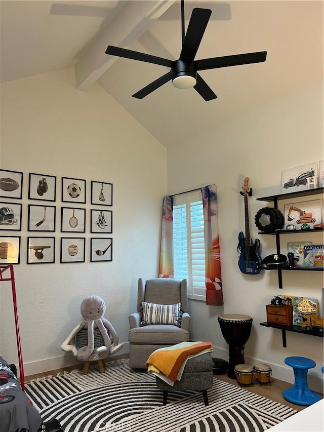 sitting room with lofted ceiling with beams, hardwood / wood-style flooring, and ceiling fan