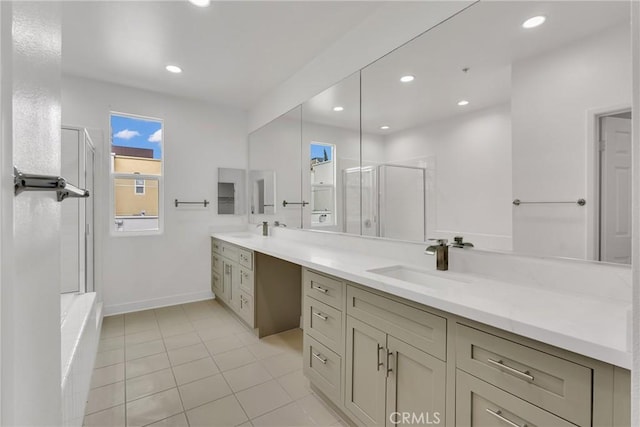 bathroom with vanity, tile patterned flooring, and a shower with door