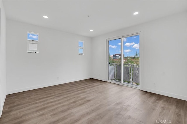 spare room featuring hardwood / wood-style floors