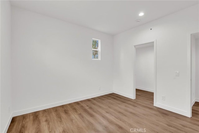 spare room with light wood-type flooring