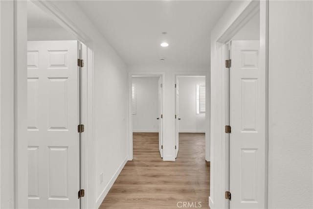 corridor featuring light hardwood / wood-style floors