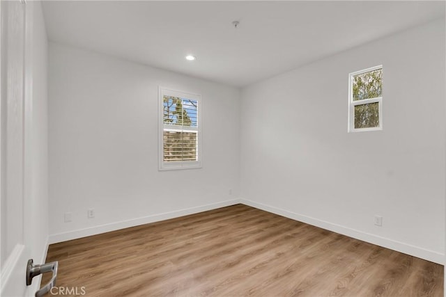 unfurnished room with plenty of natural light and light wood-type flooring